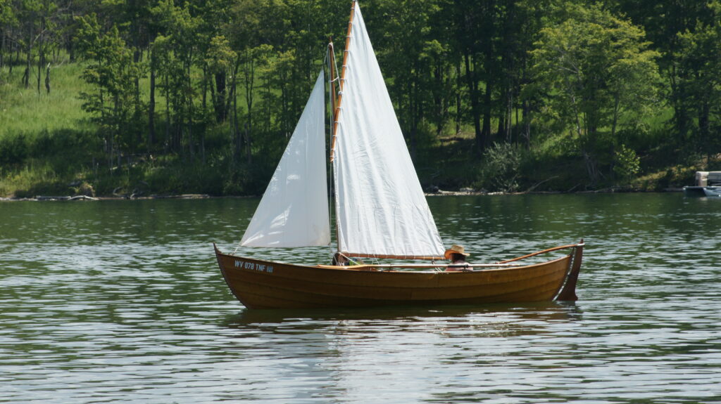 wooden sailing dinghy